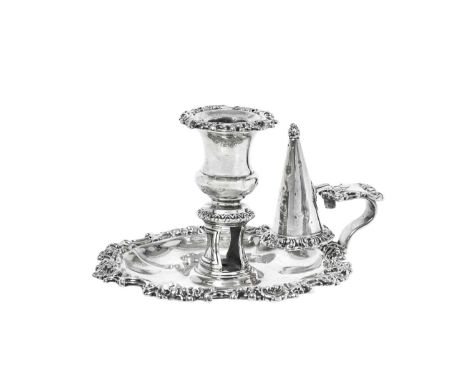 A George IV Silver Chamber-Candlestick,  by S. C. Younge and Co., Sheffield, 1826 the shaped circular base with foliage and f