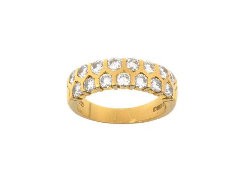 An 18 Carat Gold Diamond Half Hoop Ring two rows of round brilliant cut diamonds in yellow tension settings, to a plain polis