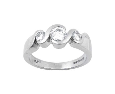 A Platinum Diamond Three Stone Ringthe graduated round brilliant cut diamonds in white rubbed over settings, to a plain polis