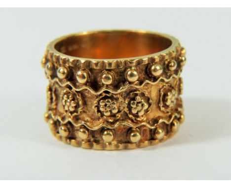 9ct Yellow Gold Ring set with decorative work surround in eternity pattern.  Deep ring at 14mm,    Finger size 'Q'  11.3g