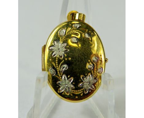 9ct Yellow Gold Locket decorated with 9ct yellow gold Flowers.  Measures approx 22 x 18 mm.   1.8g