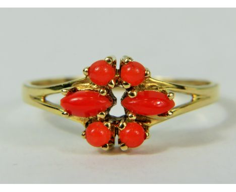 9ct Yellow Gold ring set with six small pieces of Pink Coral.   Finger size 'N-5 to P.  Hallmarked for London 1982 .  1.6g