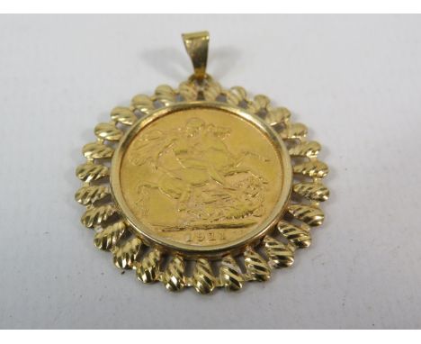 1911 Full Soverign in 9ct gold mount, 10.8 grams.