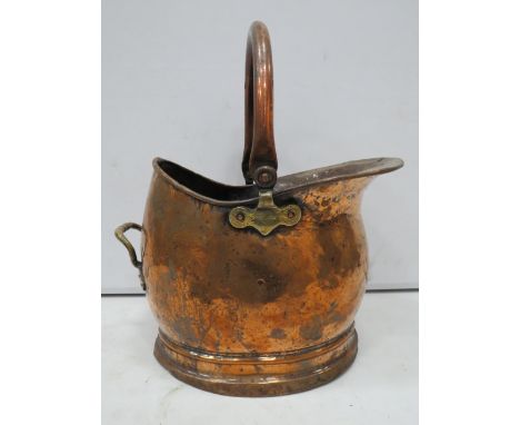 Vintage hammered copper helmet shape coal bucket.