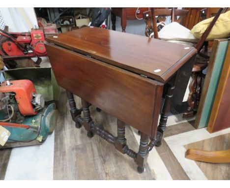 Vintage Dark Wood Drop leaf table with turned stretchers and gate leg supports.  See photos.   S2