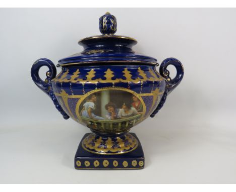 Large Royal Limoge blue and gold twin handle lidded urn vase with panels dipicting girls on a balcony and handpainted decorat