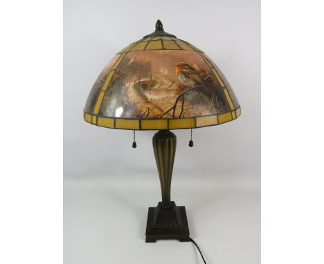 Pretty Table lamp with heavy Art Nouveau Base and  Glass shade with depicts Winter Robins.  Measures approx 22 inches tall. I