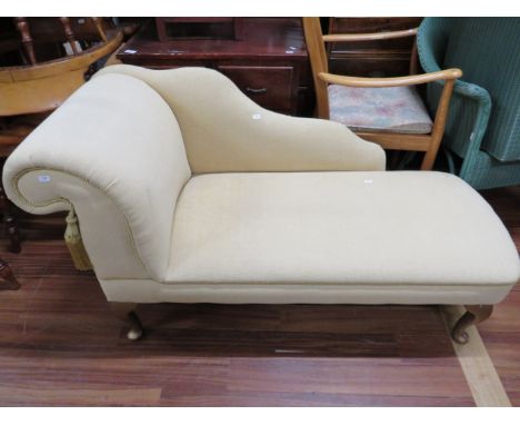 Reproduction of an Edwardian Style Chaise raised on short Cabriole legs, upholstered in very clean light material. Great cond