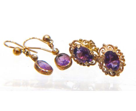 Two Pairs of 9ct Gold Amethyst set ear studs. 1.6g in total .  See photos. 