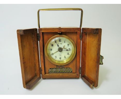 Small German made Carriage Alarm clock in running order. 4 inches tall.   Requires key. See photos. 