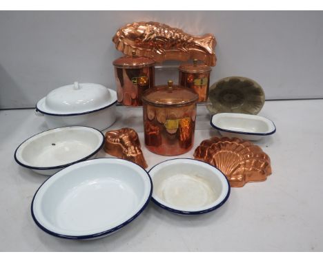 Various vintage enamel kitchen dishes, copper storage jars and jelly moulds.