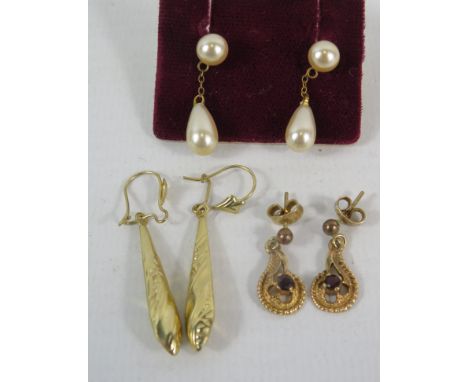 Three pairs of 9ct gold earrrings.