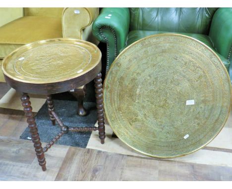 Bobbin turned small table with hammered brass top along with a large middle eastern brass charger. See photos. 