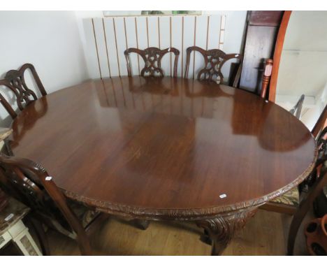 Large Wind out Oval Mahogany Dining Table with two extention pieces which each measure 24 inches wide. Raised on Carved Cabri