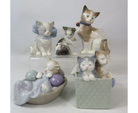 5 Nao and Lladro cat figurines.