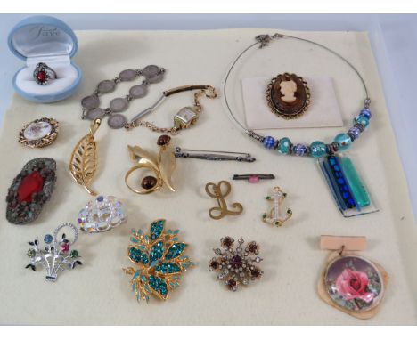 Selection of various vintage costume jewellery including a sterling silver coin bracelet and a rolled gold watch.