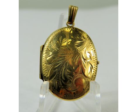 9ct Yellow Gold Locket with chased decoration. Measures approx 28 x 20 mm.   Total weight  3.0g