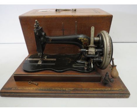 Antique Sewing machine in wooden marquetry case, Made in Baden.