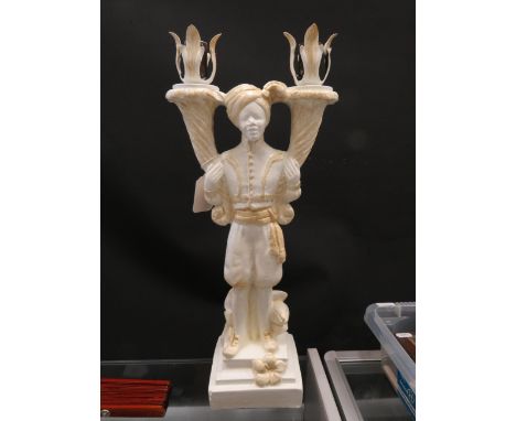 Double candlestick shaped as a Blackamoor. Measures approx 20 inches tall. See photos. 
