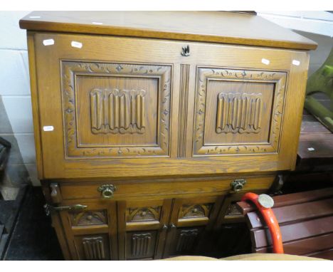 Old Charm Style Computer desk styled as a Vintage Bureau in medium Oak.  Measures H:44 x W:34 x D:24 Inches. See photos.  S2
