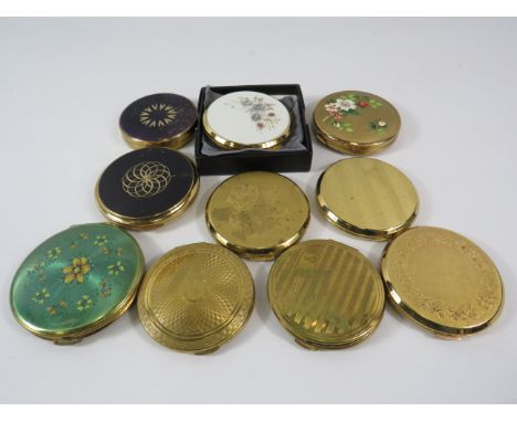 10 Gold tone compacts by Stratton, Kigu etc.