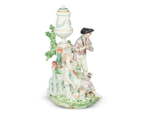 A large Derby pastoral figure group, circa 1773Modelled as a shepherdess resting beside a fountain surmounted by a classical 