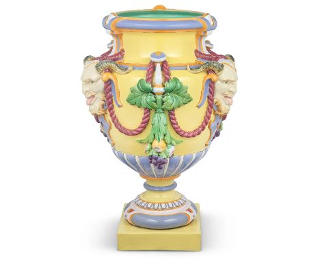 A monumental Minton majolica 'Bacchus' vase, circa 1870Of tremendous size, the urn form applied with three satyr's masks alte