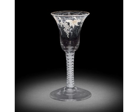A Beilby enamelled opaque twist wine glass, circa 1765The bell bowl painted in opaque white with a border of fruiting vine, t