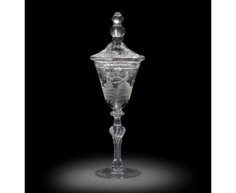 A fine Dutch engraved light baluster marriage goblet and a cover, circa 1750The generous round funnel bowl decorated with a g