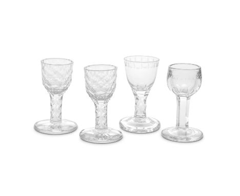 Four good facet stem firing glasses, circa 1770-80Comprising a pair with faceted ogee bowls cut with pairs of notches on each
