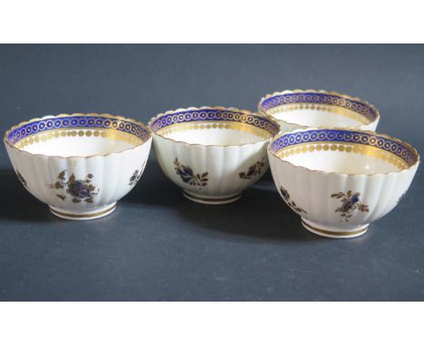 Four Caughley Porcelain Blue and Gilt Tea Bowls, circa 1790 