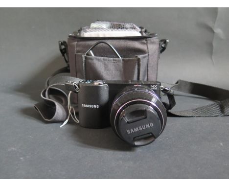 A Samsung NX1000 Mirrorless Digital Camera with 20-50mm Lens 