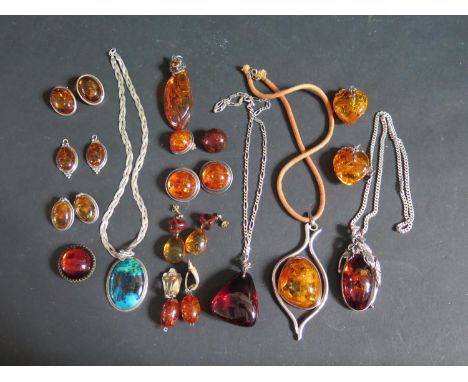 A Collection of Silver Mounted and other Amber Pendants and Earrings , silver necklaces, Israeli silver pendant etc. 