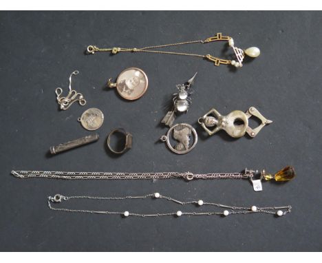 A Box of Odd Costume Jewellery including an early steel football pendant, risqué cigar cutter etc. 