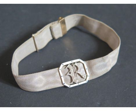 A Victorian Diamond, Enamel and Gold (unmarked) Silk Band Bracelet decorated with the initial R 