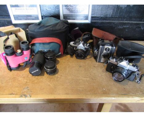 Nikon lens, 2 other lenses and vintage cameras and a pair pink RSPB binoculars