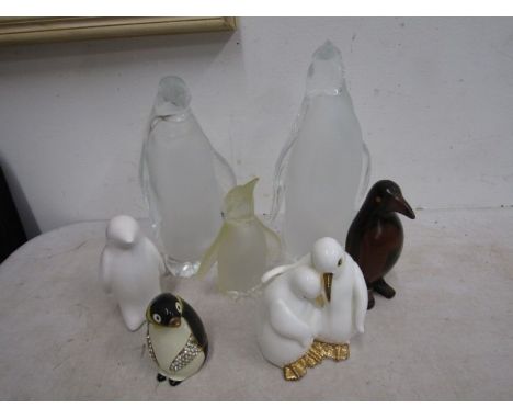 acrylic, ceramic and wooden penguins