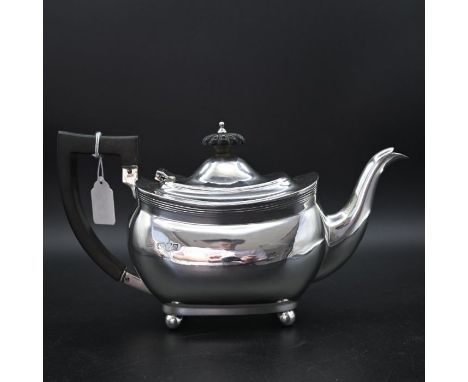 Silver teapot supported on four ball feet with blackwood harp handle, Chester 1918, gross weight 565g