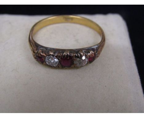 'Gold' ring stamped 18ct 3.34gms size Q with red and white stoneslooks to have been repaired/ extended- see photos