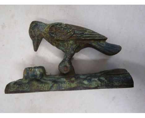 Cast iron woodpecker door knocker