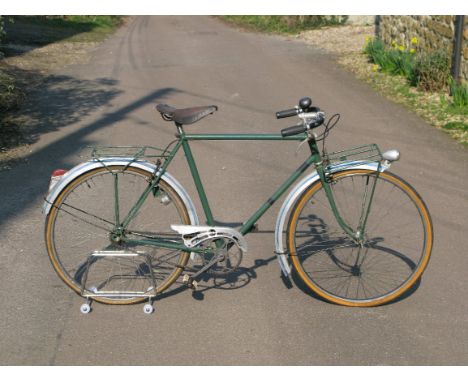 *A French Bicycle, having a 22 1/2-inch lug-less frame,  a front and rear luggage rack, chain-guard, centre-pull calliper bra