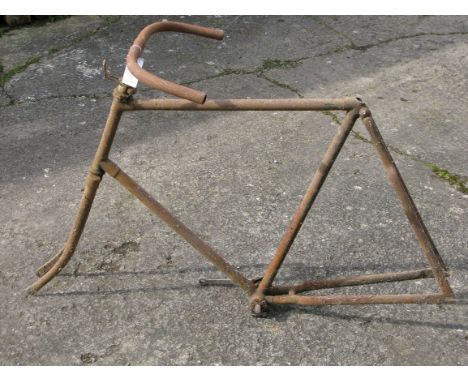 *An Early Bicycle Frame. Having just been removed from storage, a circa 1900 gentleman's 24-inch bicycle frame with track end