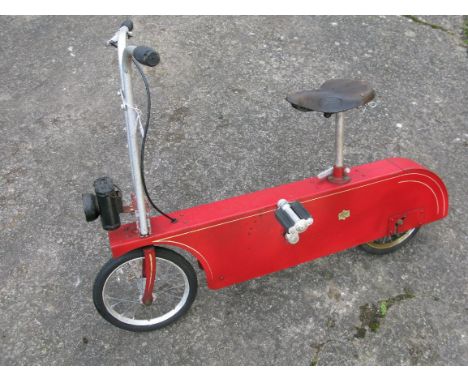 *A 'Teddy' Juvenile Bicycle. An unusual bicycle design with a combination chassis and chain casing in red enamelled steel,  w