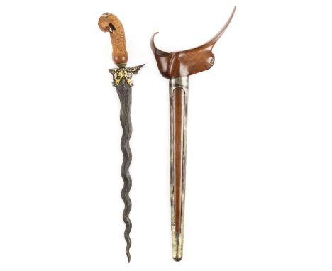 *Kris. Indonesian Kris,  the 37.5cm wavy blade with gold decoration, gilt metal cup, vegetable ivory carved hilt, 47.5cm long