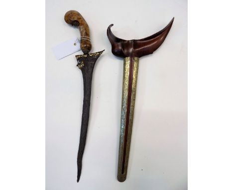 *Kris. Indonesian Kris,  the 33cm wavy iron blade with watered effect and inlaid with gold, with carved wood Garuda hilt, 44c