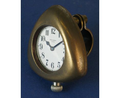 *Cycling Watch. A triangular frame holding a white-dialled watch inscribed 'New Haven USA',  with its correct thief-proof han