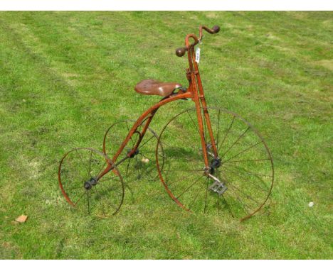 *A c1900 Hirondelle Child's Tricycle. An imposing French tricycle with two 15-inch rear wheels and a 24-inch steering and dri