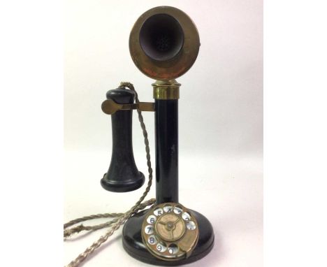 VINTAGE CANDLESTICK TELEPHONE, EARLY 20TH CENTURY  constructed in black lacquered metal and brass32cm high 