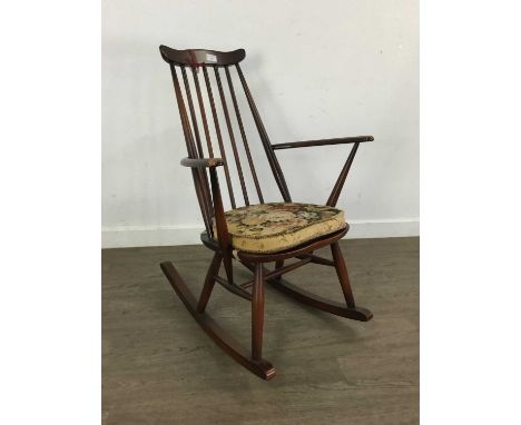 DARK STAINED ERCOL ROCKING CHAIR, with original cushion85cm high