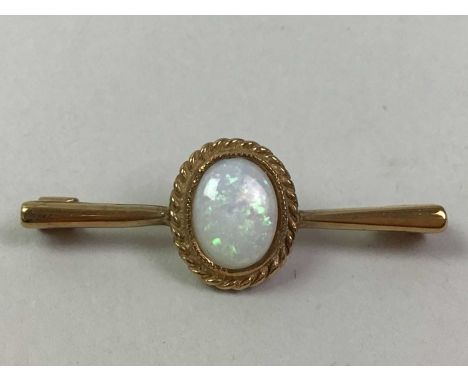 OPAL BAR BROOCH, in nine carat gold, along with a pair of opal double earringsQty: 2